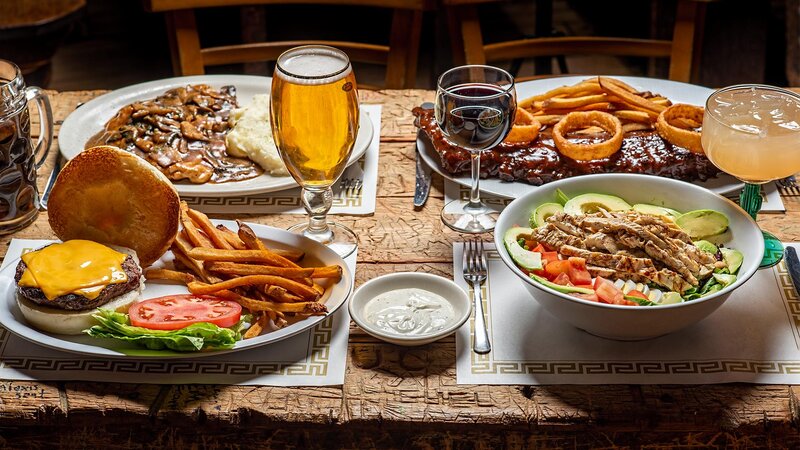 Steak, burger, salad and rib entrees with glasses of wine and beer